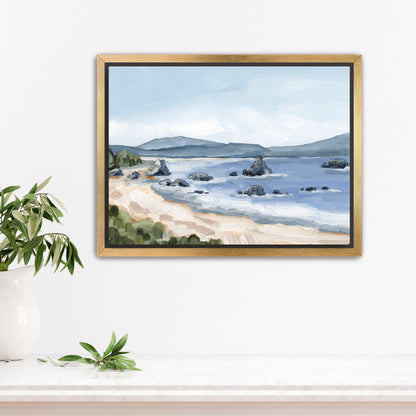 Framed painting of a coastal landscape with a beach, rocky outcroppings, and distant mountains.