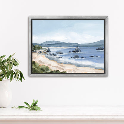 Framed painting of a coastal landscape with a beach, water, and distant mountains.