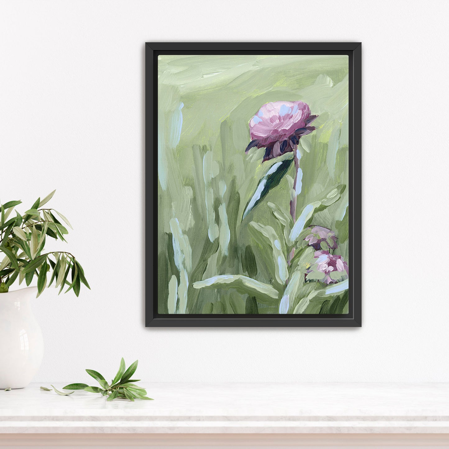 Framed painting of a pink peony flower with green foliage.