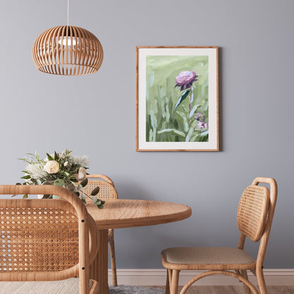 Wooden dining table with rattan chairs in a natural, bohemian style setting.